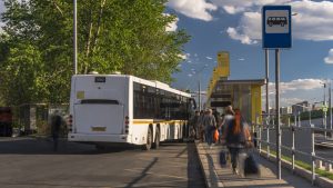 passengers waiting and boarding buses at the bus terminal